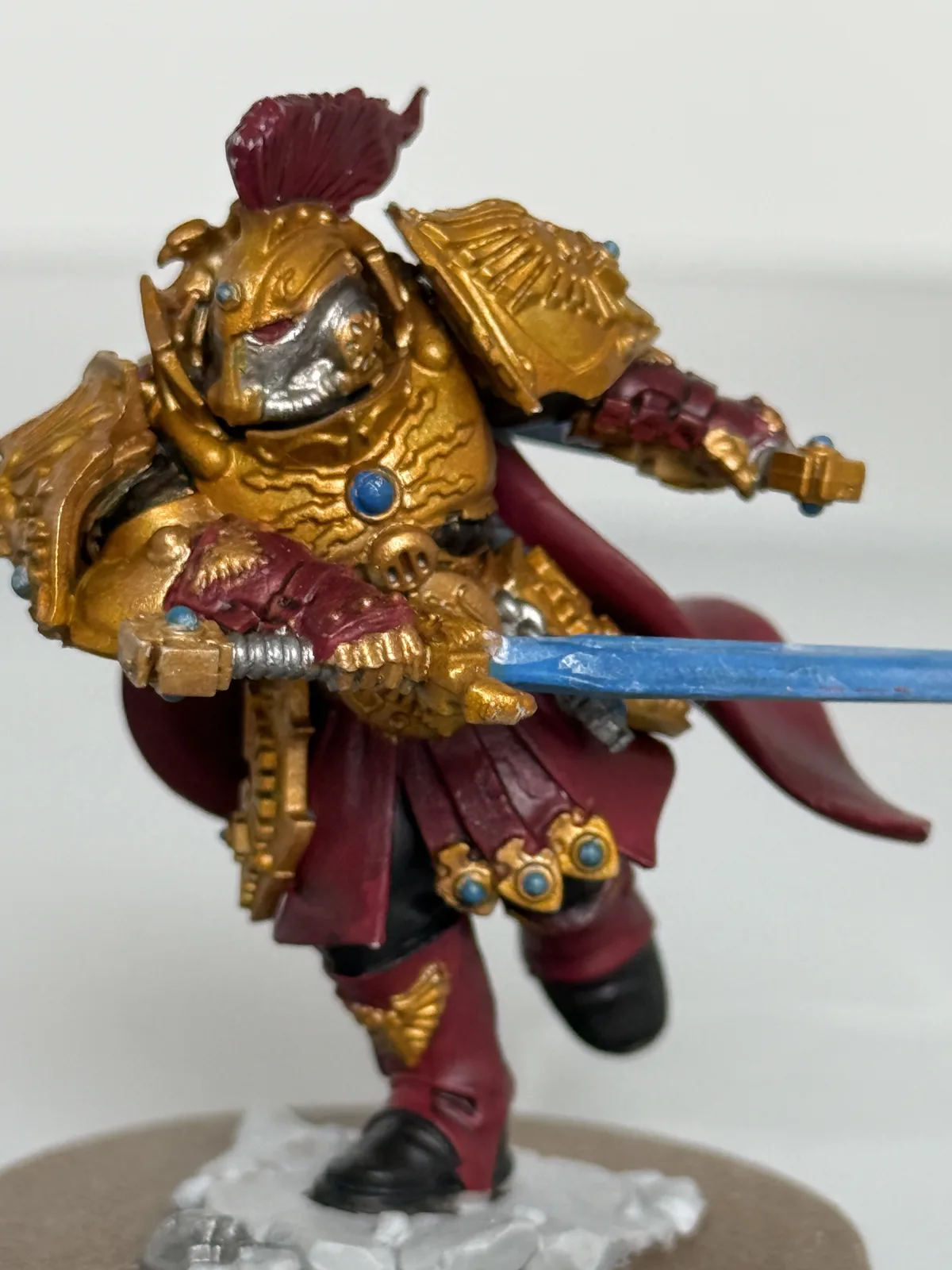 Close-up of commissioned Adeptus Custodes character showing gold armour detail